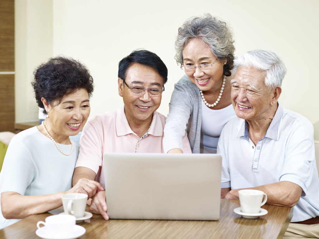 senior asian friends gathering at home