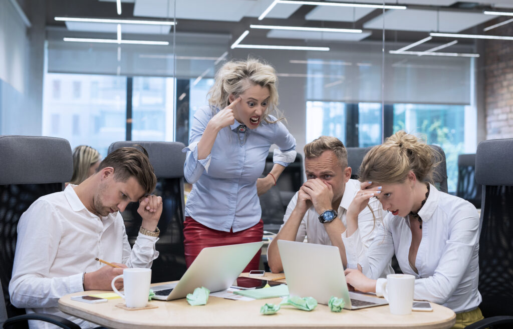 Angry boss shouting at employees Angry boss shouting at employees